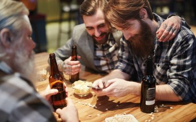 man-using-his-phone-at-a-bar-3851464